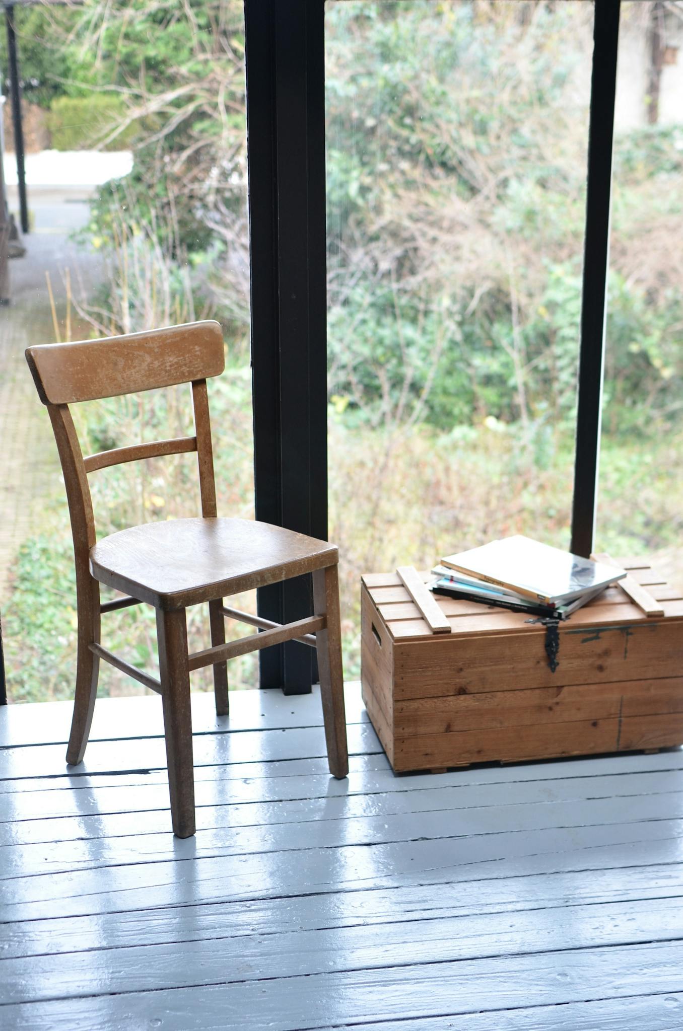 Wooden chair and box in room